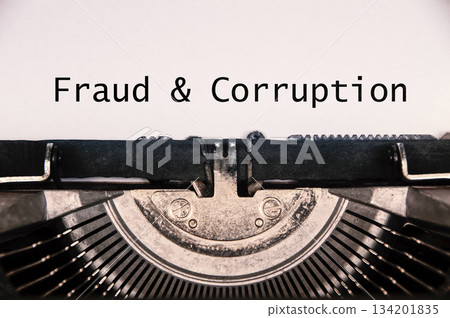 A title depicting a fraud and corruption policy heading typed on paper symbolizing organizational anti misconduct controls A title depicting a fraud and corruption policy heading typed on paper symbolizing organizational anti misconduct controls 134201835