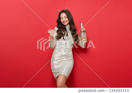 Beautiful woman with glass of champagne Beautiful woman with glass of champagne 134203153