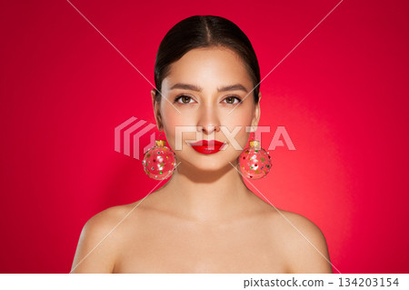 Portrait of beautiful young woman on red background Portrait of beautiful young woman on red background 134203154