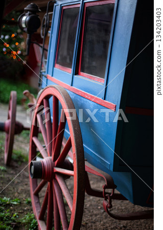 Rustic carriage painted in red and blue Rustic carriage painted in red and blue 134203403