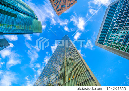 Tokyo cityscape in Japan, December. Swirling clouds pass by quickly... Shiodome business district. Something mysterious... 134203833