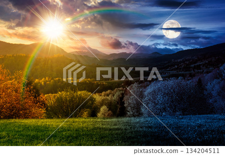 forested hills on spring equinox. day and night time change concept. beautiful scenery in mountains with sun and moon at twilight. rolling countryside landscape. harmony and progress calendar forested hills on spring equinox. day and night time change concept. beautiful scenery in mountains with sun and moon at twilight. rolling countryside landscape. harmony and progress calendar 134204511