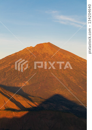 Rinjani Volcano glowing sunrise light Lombok Indonesia. Rinjani Volcano glowing sunrise light Lombok Indonesia. 134204640