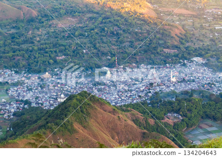 Sembalun town valley sunrise view with morning mist Sembalun town valley sunrise view with morning mist 134204643