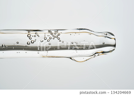 Cosmetic pipette dispensing serum with bubbles Cosmetic pipette dispensing serum with bubbles 134204669