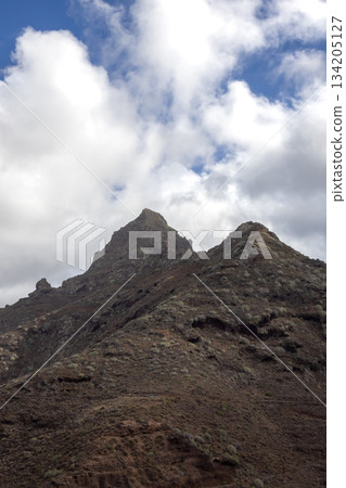 Peeks of coastal mountains, Punta de Hidalgo, Tenerife, Spain Peeks of coastal mountains, Punta de Hidalgo, Tenerife, Spain 134205127