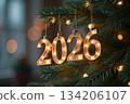 Hanging 2026 luminous numbers on Christmas tree 134206107