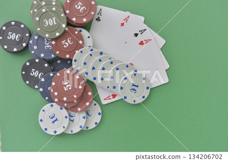 casino chips arranged on green table casino chips arranged on green table 134206702
