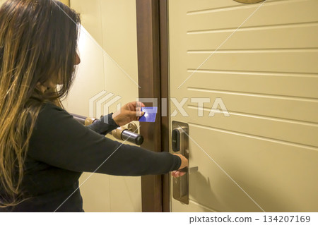 Person using a keycard to unlock a modern door, key electronic lock, hotel room, holidays in mallorca, spain Person using a keycard to unlock a modern door, key electronic lock, hotel room, holidays in mallorca, spain 134207169