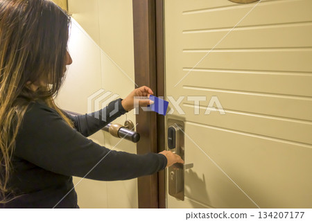 Person using a keycard to unlock a modern door, key electronic lock, hotel room, holidays in mallorca, spain 134207177