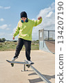 young, teenager, with skateboard, jumping, on the track, with headphones, 134207190