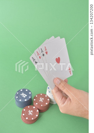 hand playing cards on green table hand playing cards on green table 134207200