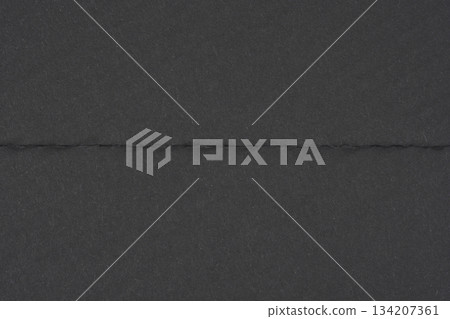 Folded Black Paper Background 134207361