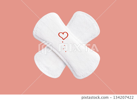 Feminine hygiene pad on a pink background. Concept of feminine hygiene during menstruation. top view. 134207422