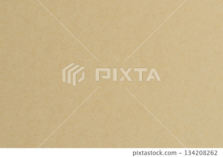 Texture of a plain brown paper sheet on a flat surface Texture of a plain brown paper sheet on a flat surface 134208262