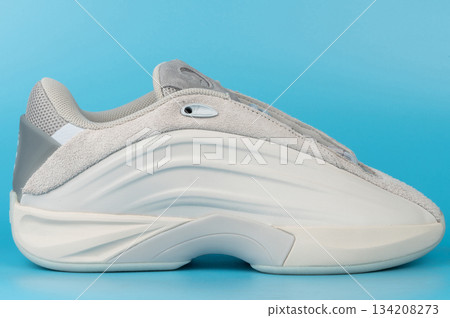 Modern sneaker design on blue background with side view 134208273
