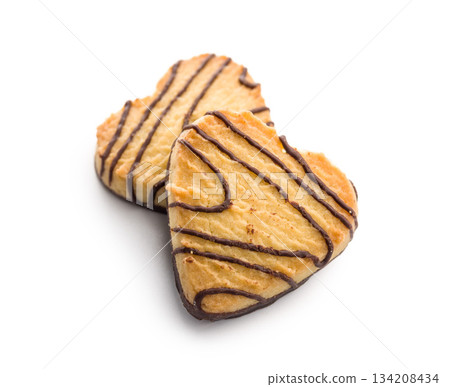 Heart shaped cookie isolated on white background. Heart shaped cookie isolated on white background. 134208434