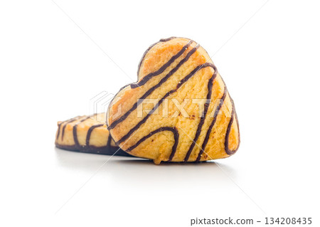 Heart shaped cookie isolated on white background. Heart shaped cookie isolated on white background. 134208435