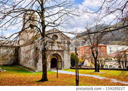 Exterior of the Monastery of Sant Pere de Camprodon in November with autumn leaves Exterior of the Monastery of Sant Pere de Camprodon in November with autumn leaves 134209227