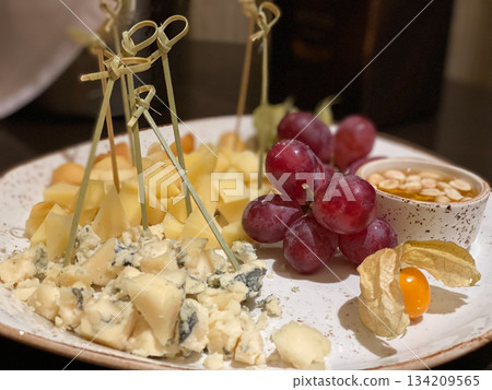 Cheese Plate with Grapes and Honey Cheese Plate with Grapes and Honey 134209565