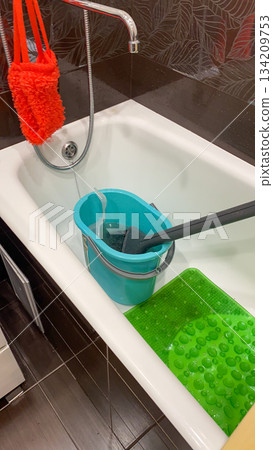 Bathroom Cleaning Setup with Mop and Bucket 134209753