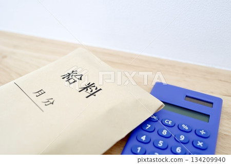 A bulging pay envelope suggests a high income and increased bonus. 134209940