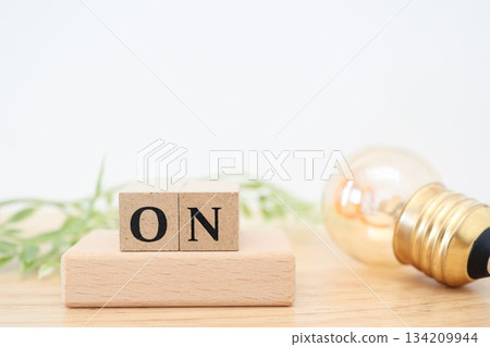 A simple image of lighting and starting indicated by a light bulb and an ON block. 134209944