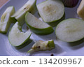 Apples slices and red onion on a white plate 134209967
