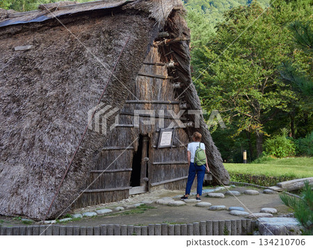 Foreign tourists enjoying the scenery of the Gassho-style Minkaen open-air museum in the World Heritage site of Shirakawa-go Foreign tourists enjoying the scenery of the Gassho-style Minkaen open-air museum in the World Heritage site of Shirakawa-go 134210706