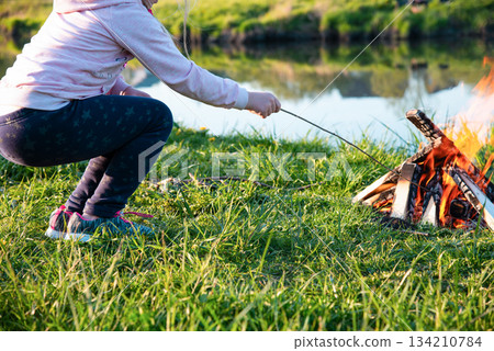 Burning fire on the shore of the reservoir. High quality photo Burning fire on the shore of the reservoir. High quality photo 134210784