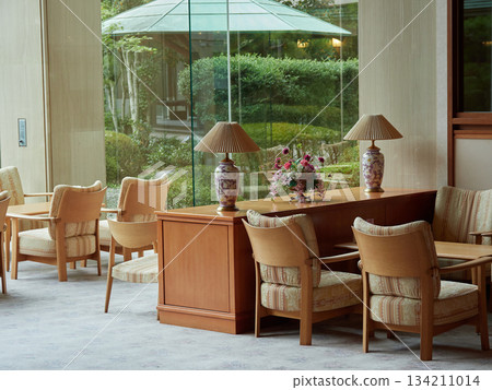 Scenery of Japanese-style garden and lobby chairs and tables in a hotel in a Japanese tourist destination Scenery of Japanese-style garden and lobby chairs and tables in a hotel in a Japanese tourist destination 134211014