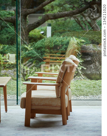 Scenery of Japanese-style garden and lobby chairs and tables in a hotel in a Japanese tourist destination Scenery of Japanese-style garden and lobby chairs and tables in a hotel in a Japanese tourist destination 134211020