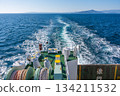 A long white wake seen from the stern of a ferry, leaving a trail on the blue sea 134211532
