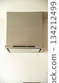 Before and after replacing a thin range hood 134212499