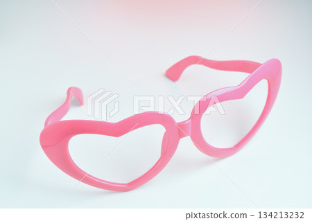 pink heart shape of glasses on white background 134213232