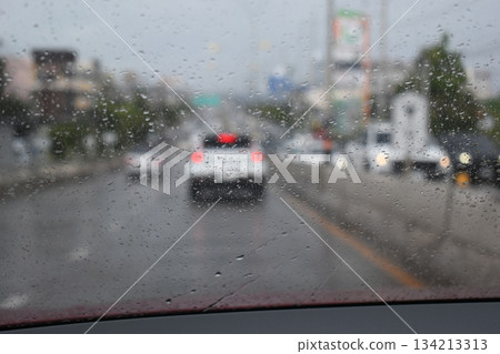 car on highway road with rainny season, blurred image car on highway road with rainny season, blurred image 134213313