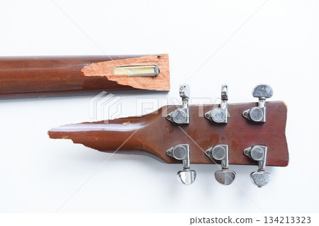 part of broken wood acoustic guitar isolated on white background 134213323