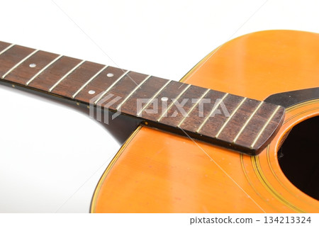 brown wood acoustic guitar isolated on white background 134213324