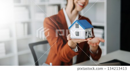 Considering buying a home, investing in real estate. Broker signs a sales agreement. Considering buying a home, investing in real estate. Broker signs a sales agreement. 134213413