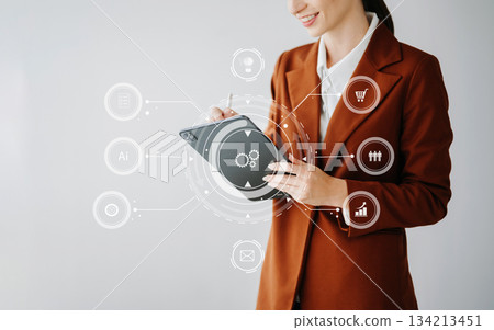 Businesswoman hand working digital marketing media in virtual screen Businesswoman hand working digital marketing media in virtual screen 134213451