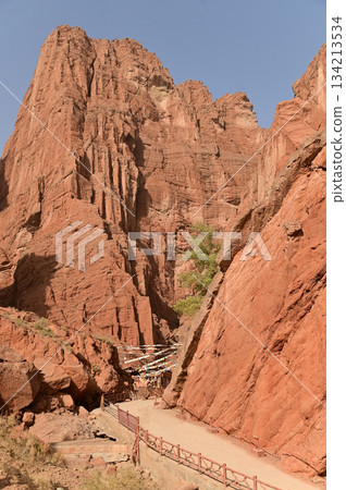 The Tianshan Grand Canyon, or Kesileya Grand Canyon, is a stunning natural feature in Xinjiang, China characterized by its distinctive red canyons formed by millions of years of wind and rain erosion. 134213534