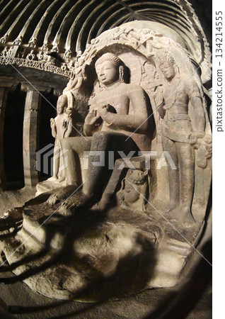 Buddha statue in Cave No.10 of the Buddhist temple at Ellora Caves. Elora a UNESCO World Heritage Site, is one of the world's largest collections of rock-cut temples and shrines. 134214555