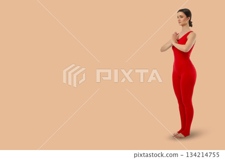 Yoga session shows a person standing in a form position 134214755