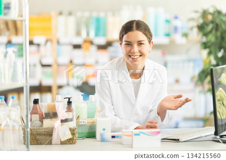 Female pharmacist invites you to shop Female pharmacist invites you to shop 134215560