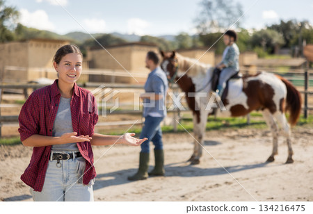Young woman posing in horse pen 134216475