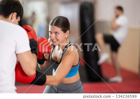 Woman sparring in boxing Woman sparring in boxing 134216599