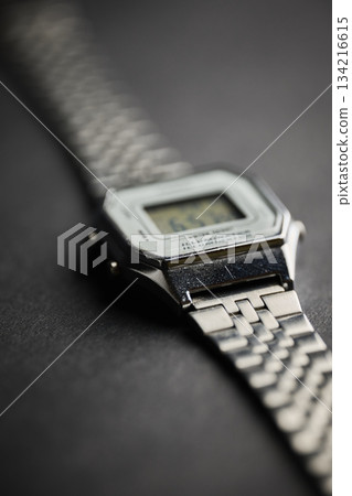 A silver digital wristwatch shows time and date details A silver digital wristwatch shows time and date details 134216615