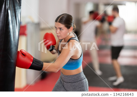 Woman training in boxing section 134216643