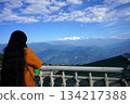 Rear view of woman overlooking snow-capped Kanchenjunga 134217388