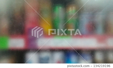 Blurry photo of bottled drinks on supermarket shelves Blurry photo of bottled drinks on supermarket shelves 134219196